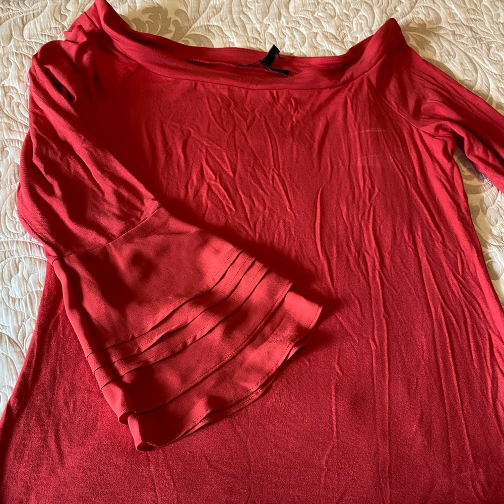 NWOT. White House Black Market top. Bell sleeves. Corral color XL. Never worn!